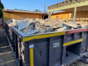 12 yard dumpster with concrete Bins4Less